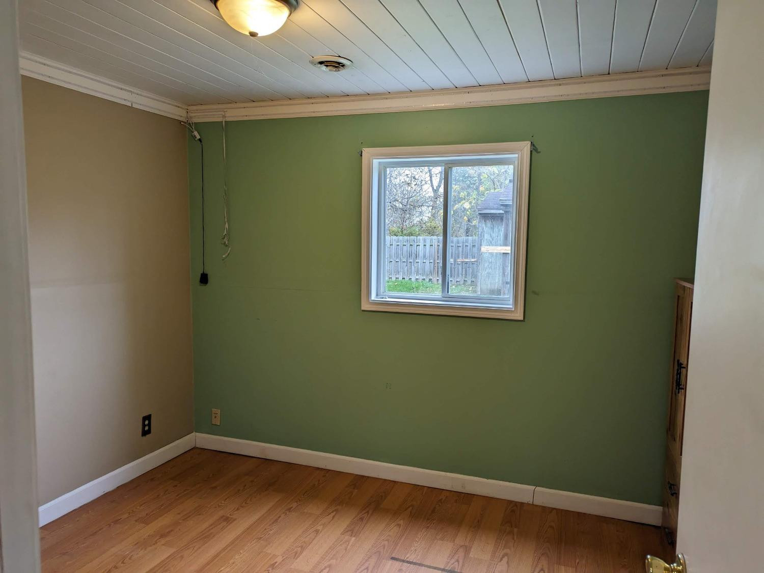 23809 Shelby Road Lowell, IN 46356 - Photo 5 of 48 an empty room with wooden floor and windows