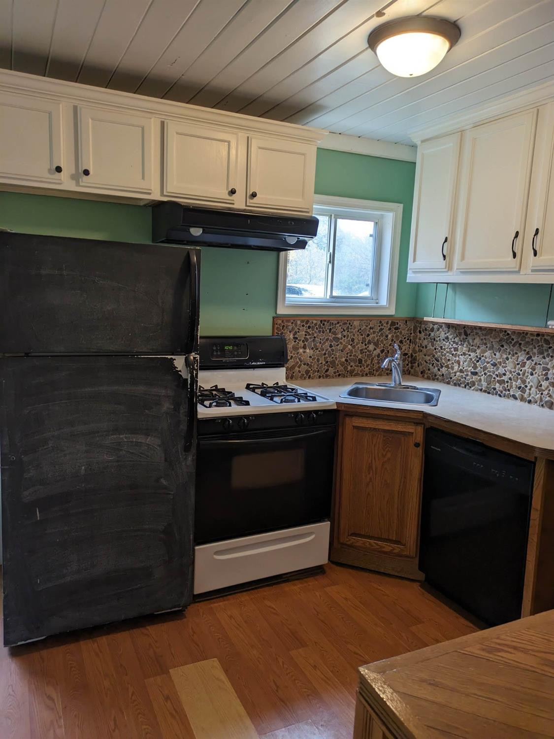 23809 Shelby Road Lowell, IN 46356 - Photo 7 of 48 a kitchen with granite countertop a stove and a sink