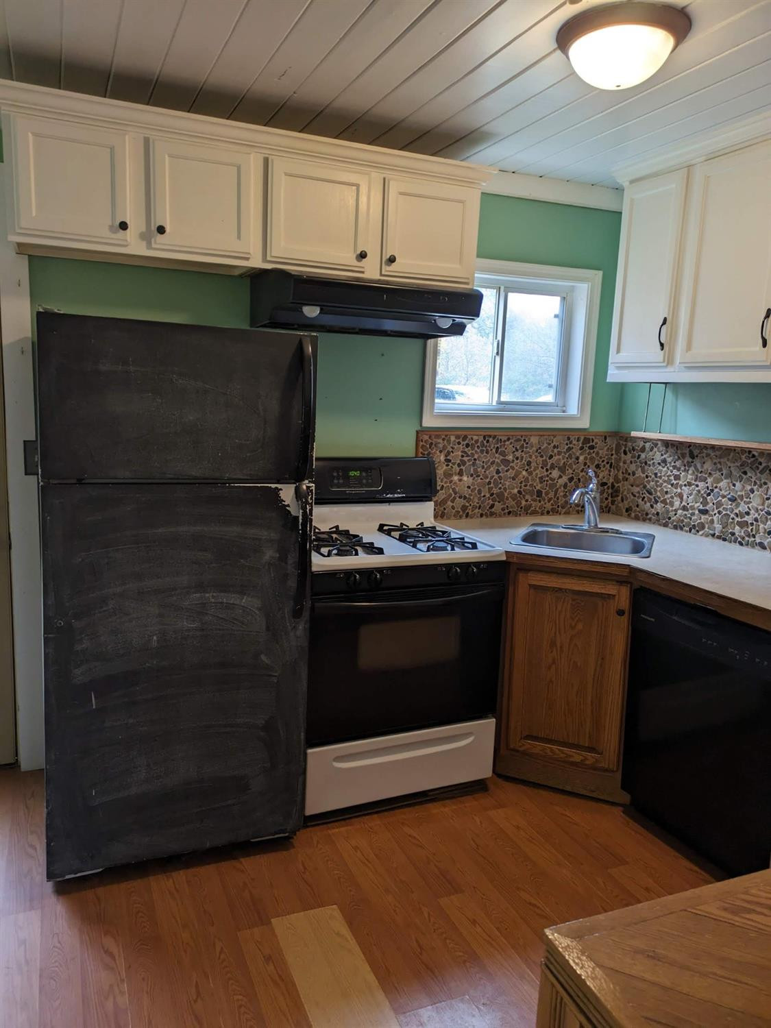 23809 Shelby Road Lowell, IN 46356 - Photo 8 of 48 a kitchen with granite countertop a stove cabinets and a sink