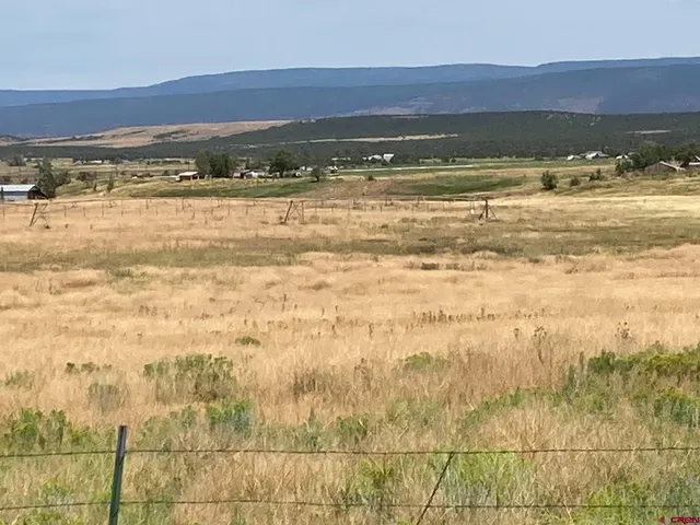 a view of an ocean and a mountain