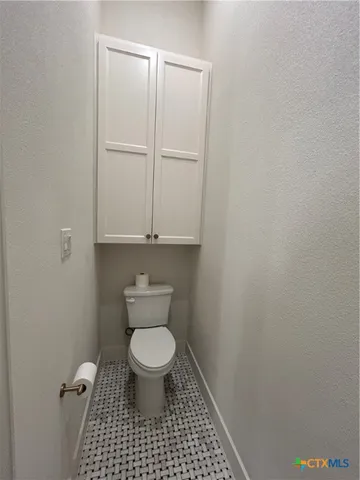 a bathroom with a double vanity sink a mirror and a shower