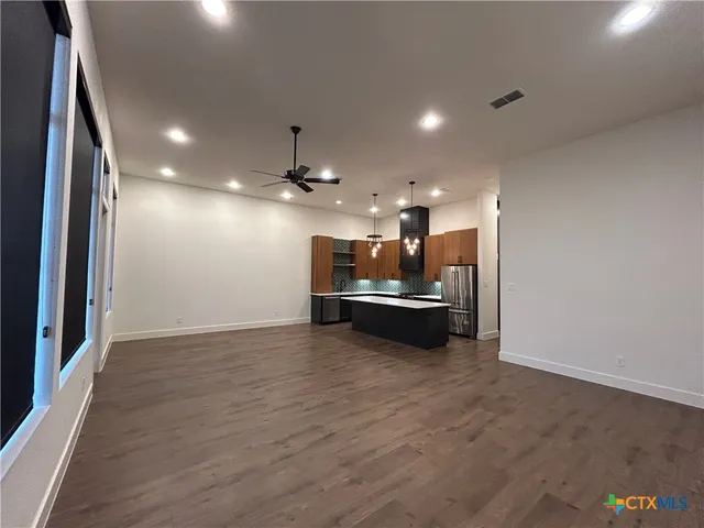 a view of kitchen and kitchen with a sink