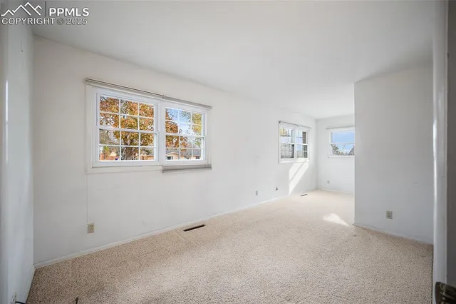 an empty room with windows