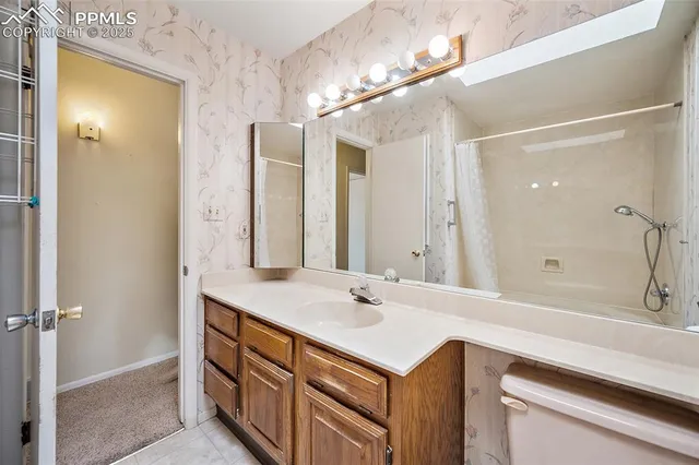 a bathroom with a sink double vanity and a mirror