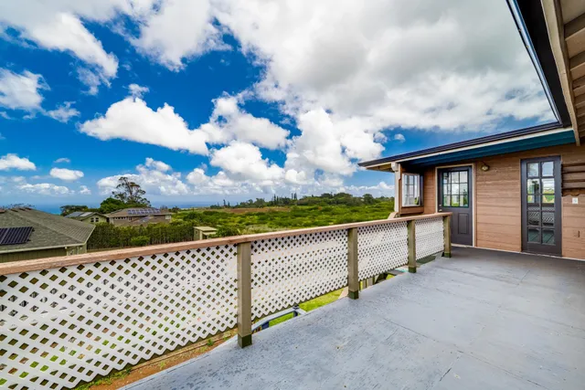a view of a balcony with city view