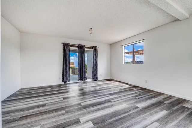 a bathroom with a sink a mirror and a bath tub