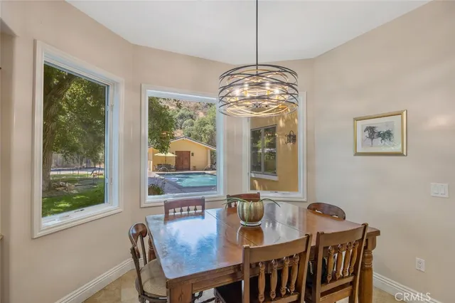 a living room with furniture large window and a fireplace