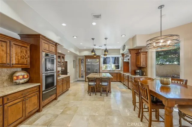 a living room with furniture a flat screen tv and a window