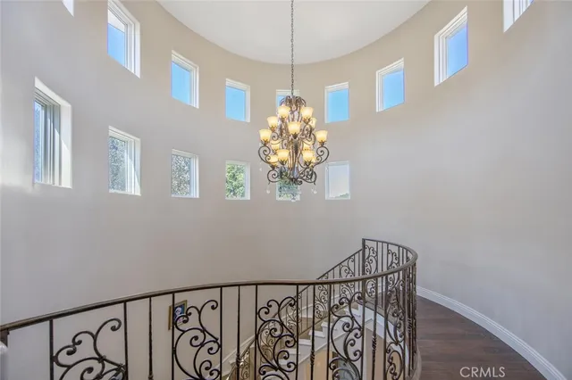 a spacious bedroom with a bed and a window