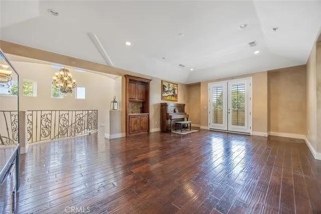 a spacious bathroom with a tub sink and mirror