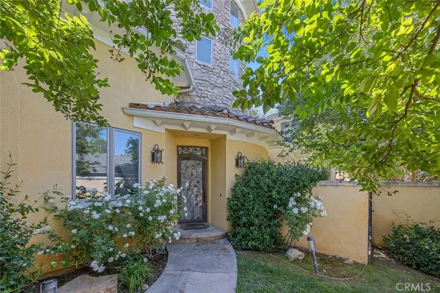 a view of sign board with a garden