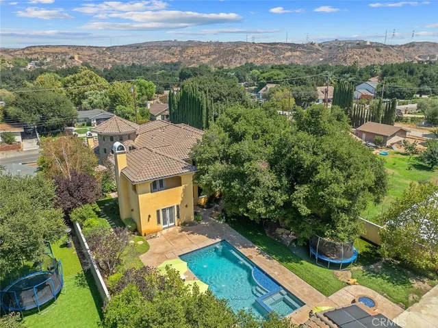 a view of a house with a yard and garage