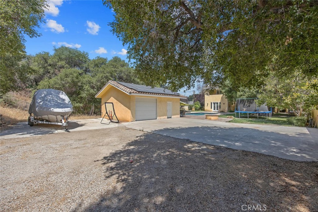 21120 Placerita Canyon Road Newhall, CA 91321 - Photo 46 of 53 RV parking with access road and second detached garage
