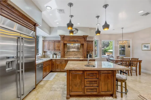 a kitchen with a stove and a refrigerator