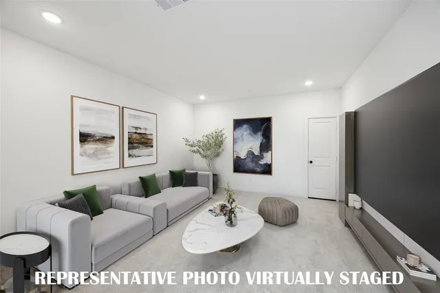 a living room with furniture a rug and a table