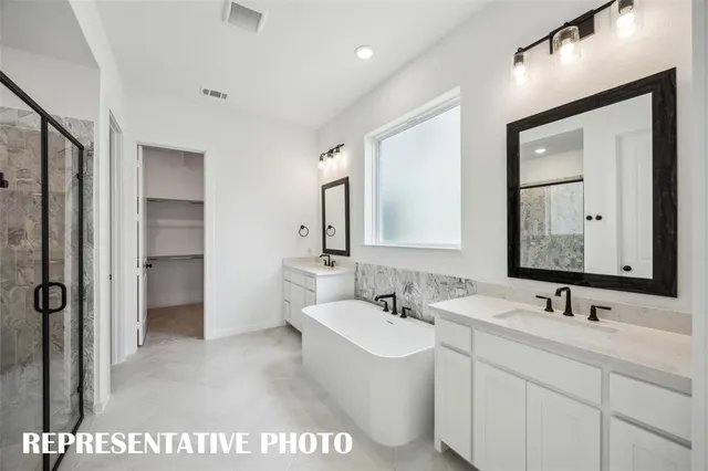 a spacious bedroom with a large bed and a large window