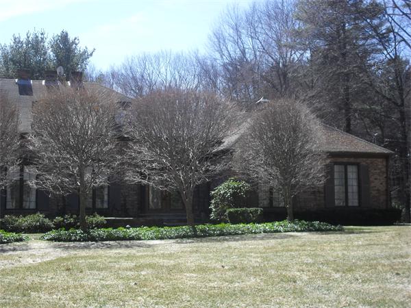 92 Frankland Road Hopkinton, MA 01748 - Photo 1 of 1 a wooden house with trees in front of it