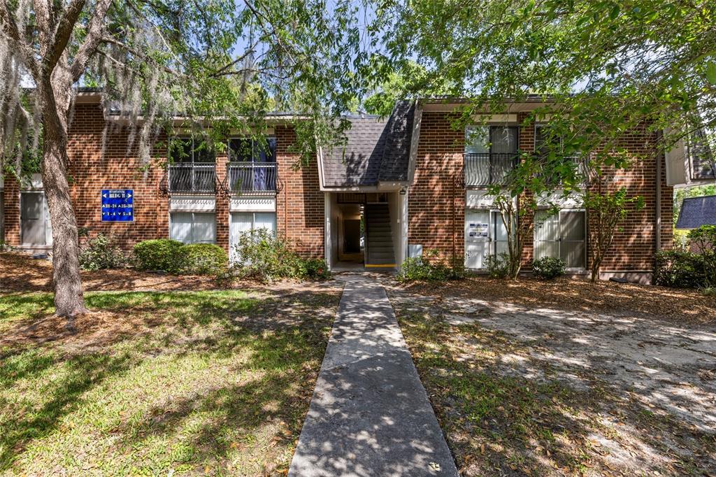 1700 Southwest 16th Court, Unit B28 Gainesville, FL 32608 - Photo 2 of 17 a front view of a house with garden