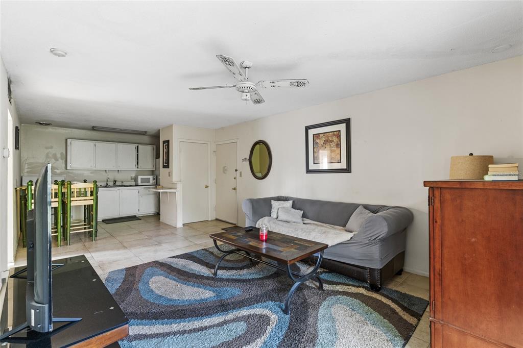 1700 Southwest 16th Court, Unit B28 Gainesville, FL 32608 - Photo 6 of 17 a living room with furniture and a table
