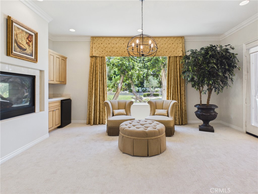1662 Cherokee Road Corona, CA 92881 - Photo 33 of 60 Dual sided fireplace at sitting area with wet bar.