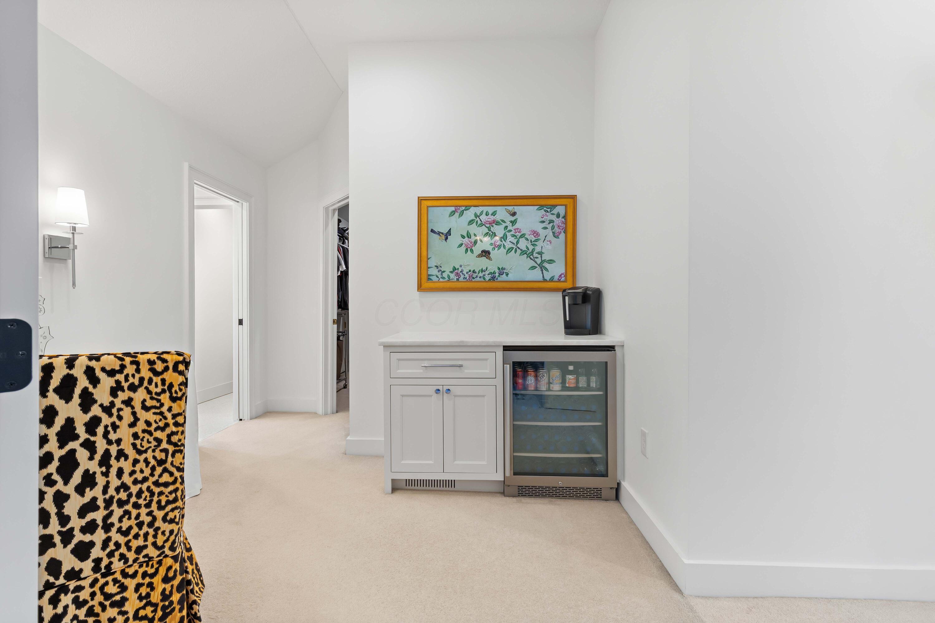 1364 Dale Ford Road Delaware, OH 43015 - Photo 45 of 112 • Light sand carpet • White painted walls • Custom built beverage center • Marble countertop • Can lighting • French doors to Bedroom • Lighted wall sconces • TV does not remain • Attic crawl space access