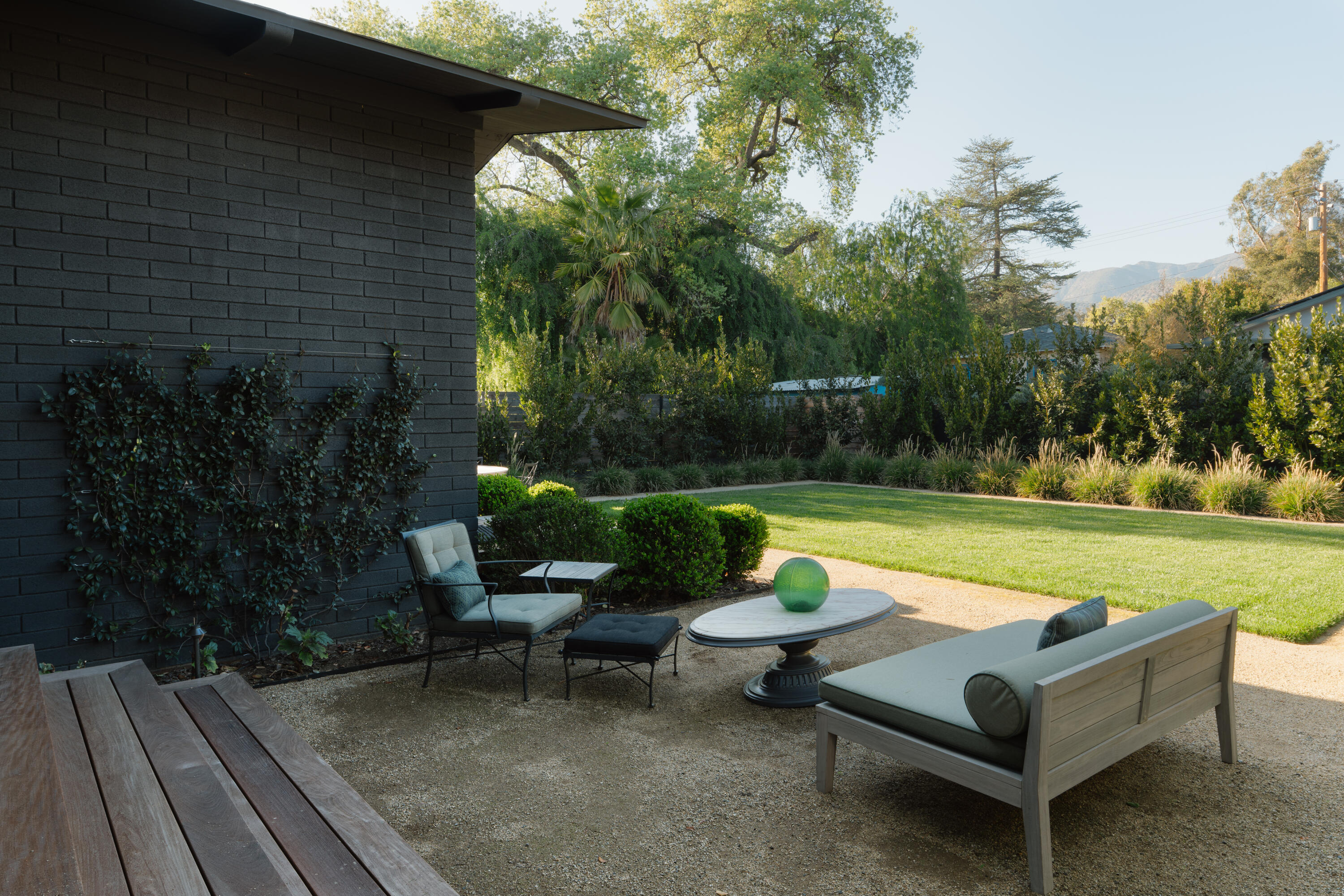 216 East Matilija Street Ojai, CA 93023 - Photo 21 of 22 a view of a patio with chairs and a table