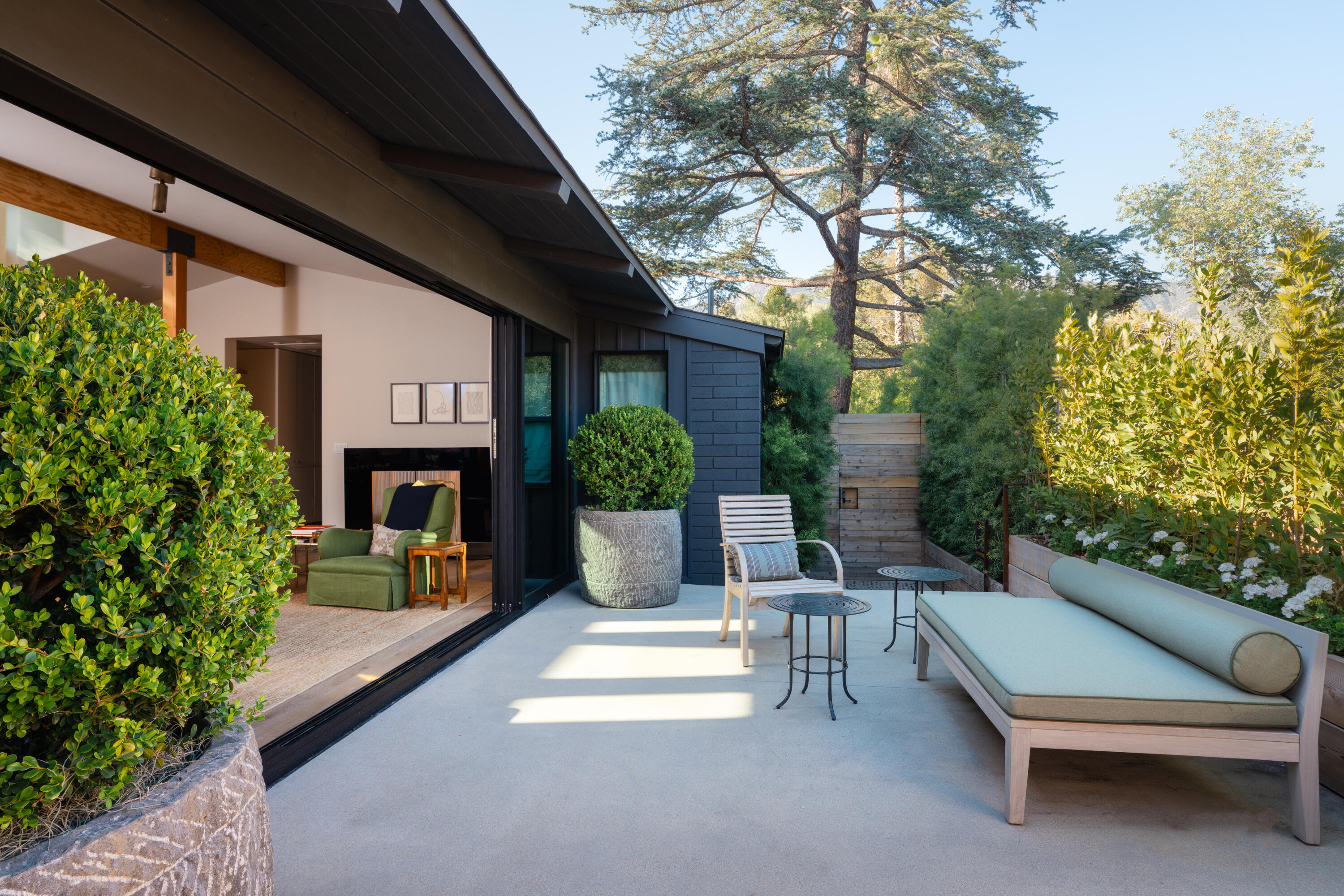216 East Matilija Street Ojai, CA 93023 - Photo 3 of 22 a view of a patio with couches table and chairs and potted plants