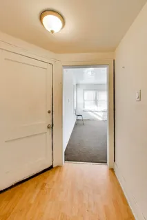 an empty room with a empty space and windows