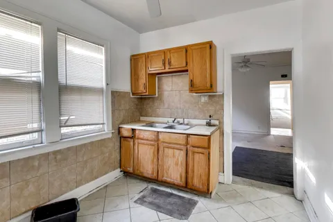 a bathroom with a sink a mirror and a bathtub