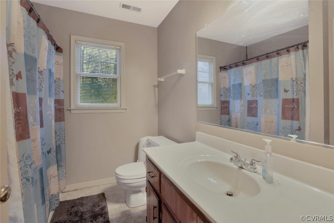 4106 Paces Ferry Road Chester, VA 23831 - Photo 14 of 23 a bathroom with a sink toilet and shower