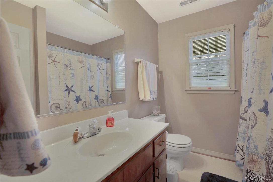 4106 Paces Ferry Road Chester, VA 23831 - Photo 18 of 23 a bathroom with a sink toilet and a mirror