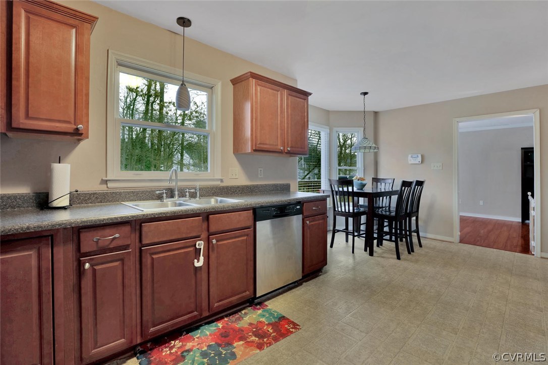 4106 Paces Ferry Road Chester, VA 23831 - Photo 6 of 23 a kitchen with granite countertop sink window and chairs