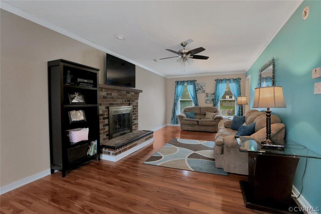 4106 Paces Ferry Road Chester, VA 23831 - Photo 9 of 23 a living room with furniture flat screen tv and a fireplace
