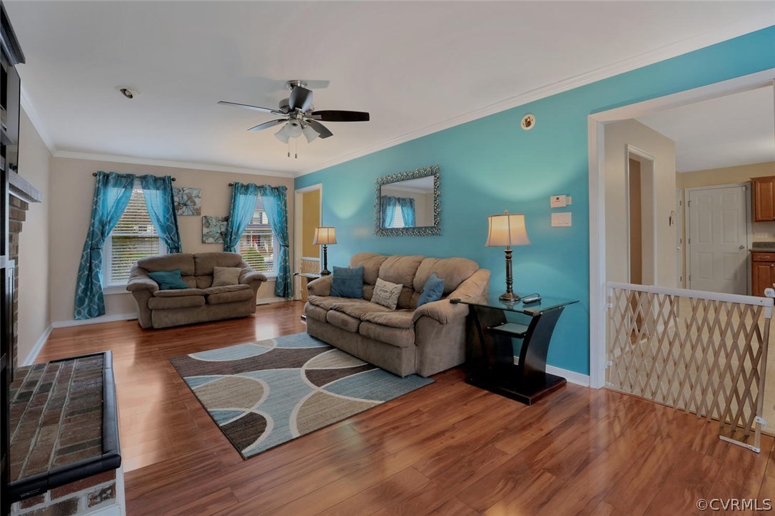 4106 Paces Ferry Road Chester, VA 23831 - Photo 10 of 23 a living room with furniture and a chandelier