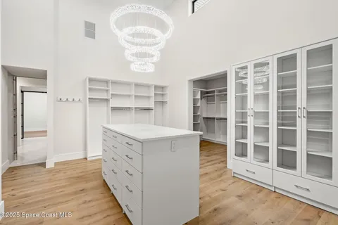 a bathroom with a tub a sink and mirror