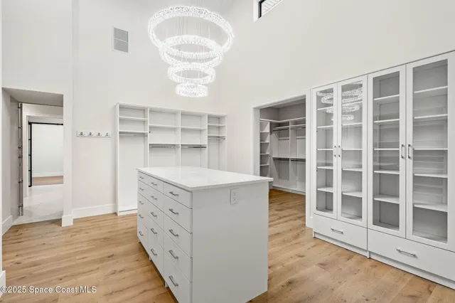 a bathroom with a tub a sink and mirror
