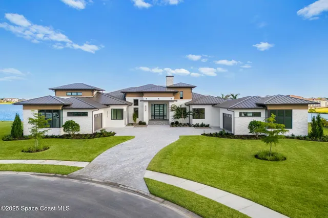 a front view of a house with a yard table and chairs