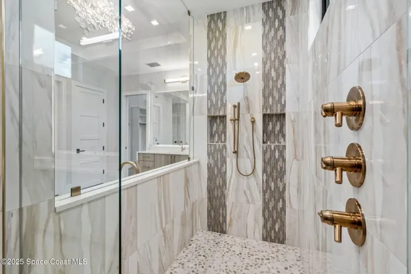 a bedroom with a large bed and a large window