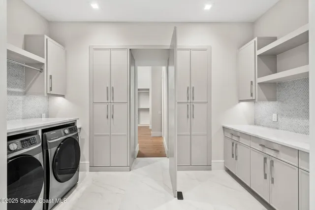 a bathroom with a double vanity sink mirror and shower