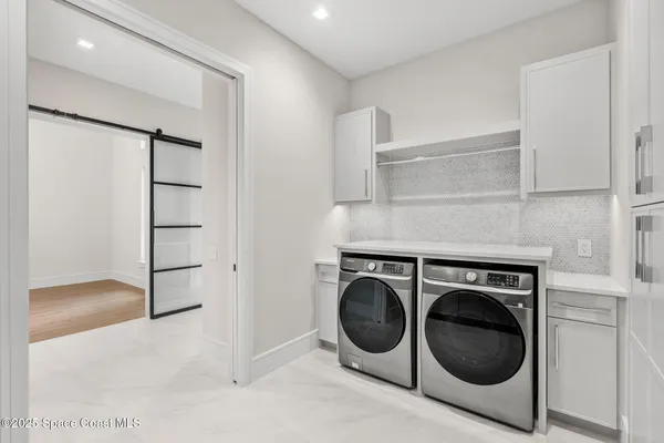 a bathroom with a sink toilet tub and shower