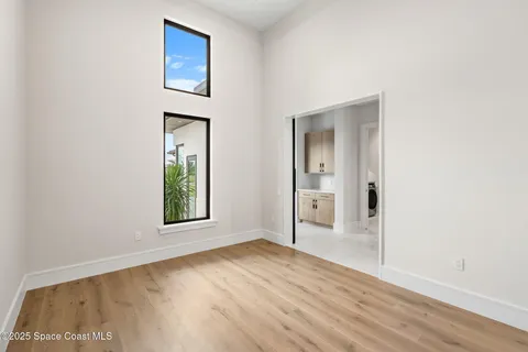 a bathroom with a toilet a sink and a mirror