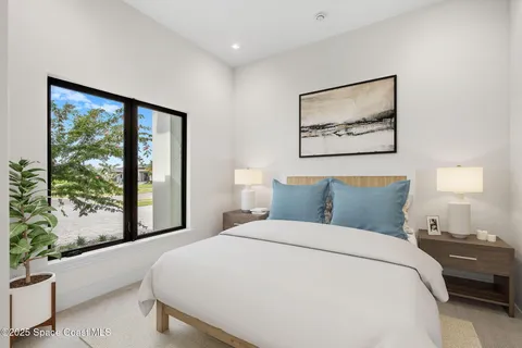 a view of a living room and floor to ceiling window