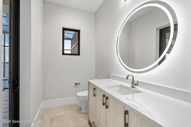 a swimming pool with yard and outdoor seating