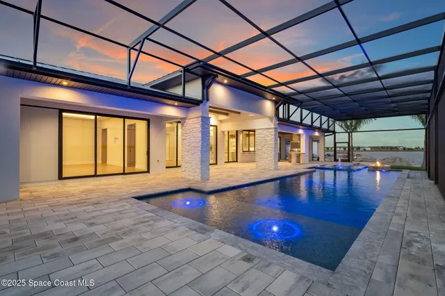an aerial view of a house with a swimming pool
