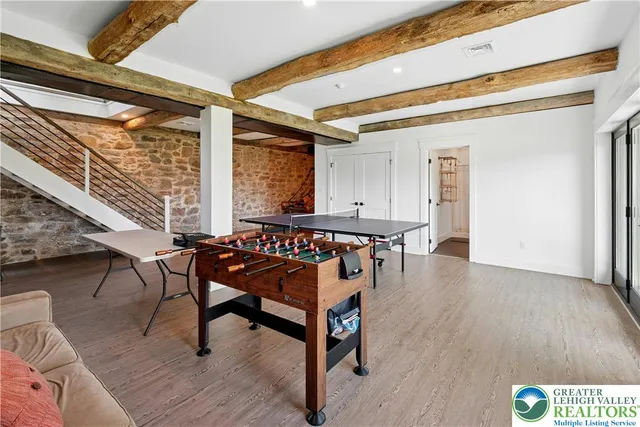 a view of a hallway with seating area