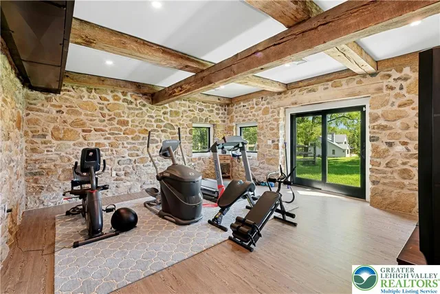 a view of a deck with furniture and garden