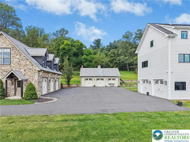 a view of a big house with a street