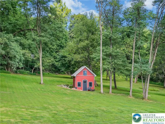 a backyard of a house with lots of green space