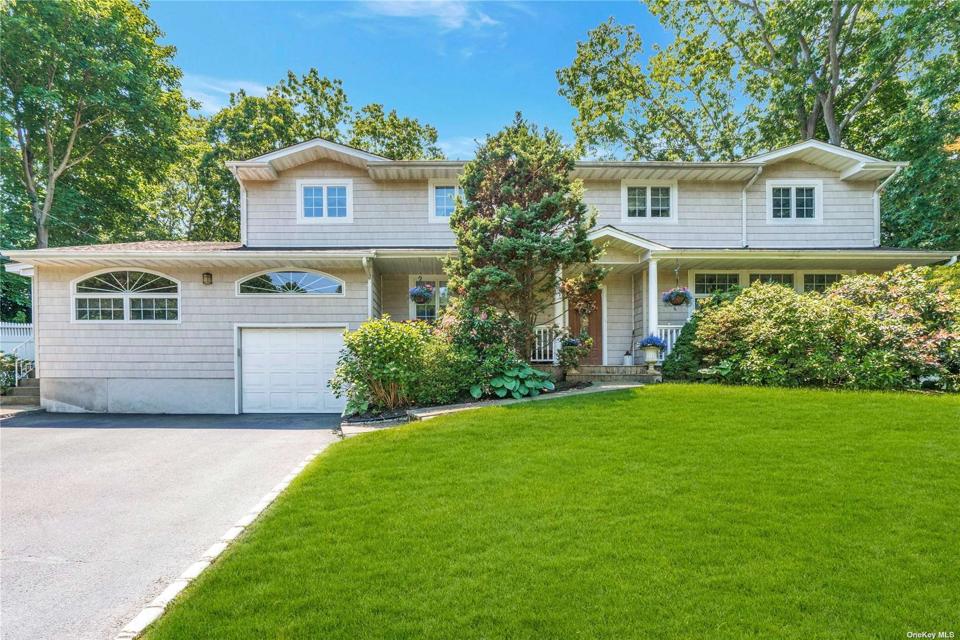 4 Thide Court Smithtown, NY 11787 - Photo 1 of 1 a view of backyard with a garden and plants