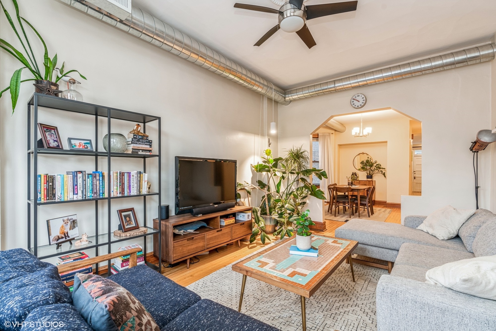 Undisclosed Address Chicago, IL 60622 - Photo 2 of 11 a living room with furniture and a flat screen tv